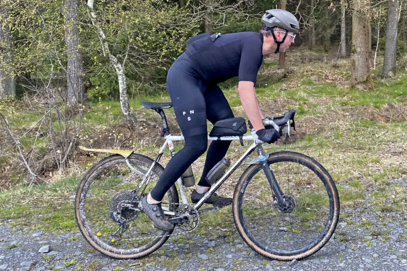 Pas Normal Studios Mechanism Pro road race cycling kit, side riding
