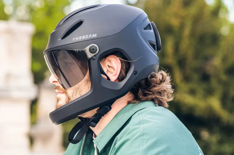 The Beam x Virgo MIPS full-face commuter ebike helmet on Kickstarter now, the safest cycling helmet for e-bikes, side view on a rider's head