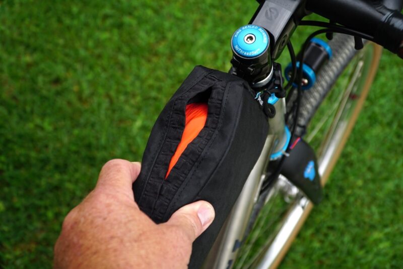 Orucase Top Tube Bag closing bag with jacket inside