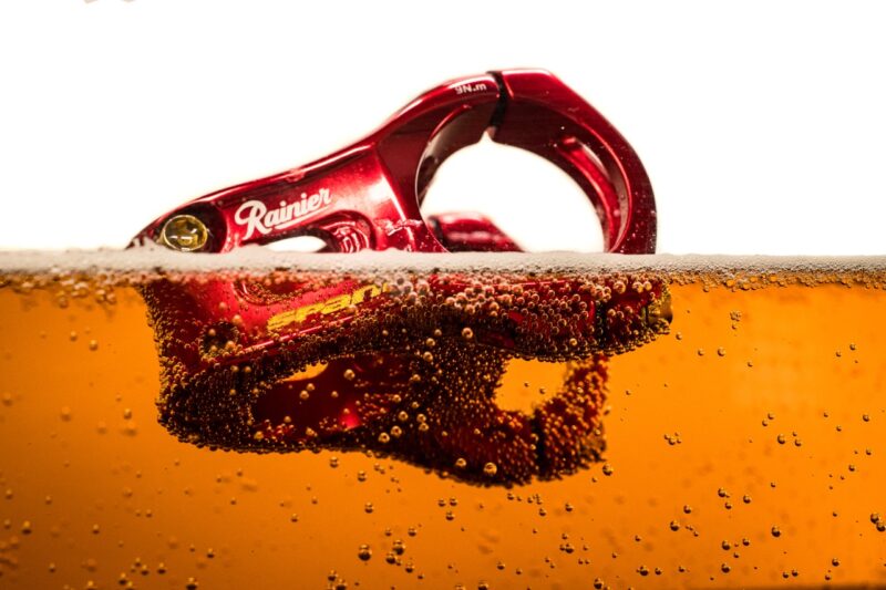 Spank x Rainier collab red stem in beer